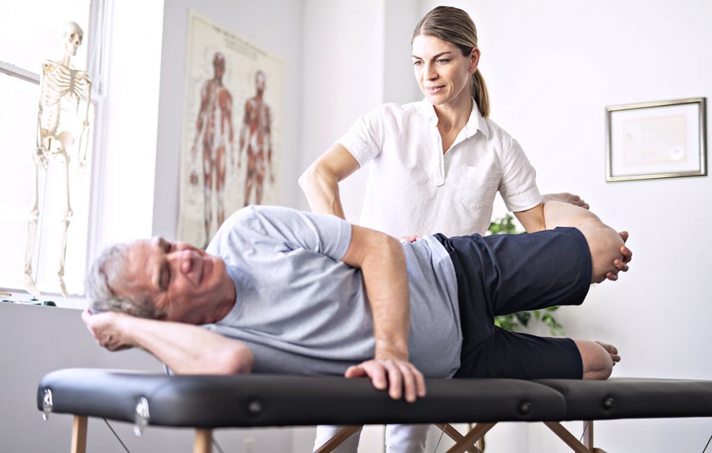 An Old Man Receiving Physical Therapy