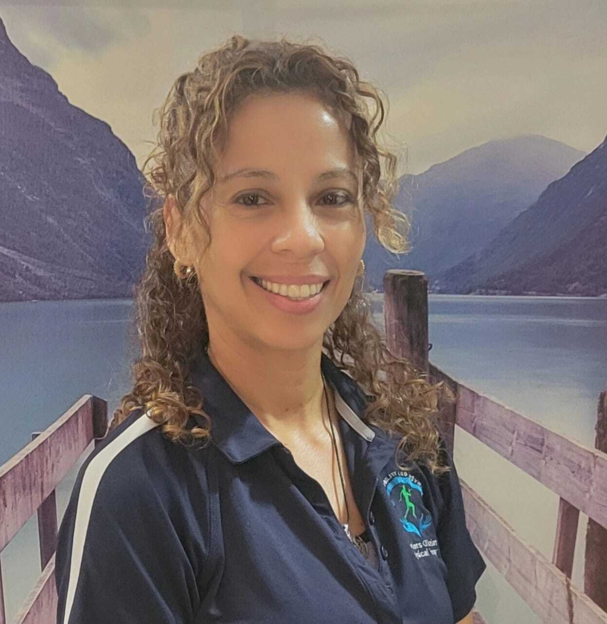 Dr. Evelyn Mora providing individualized physical therapy at Healers of Motion in Pembroke Pines