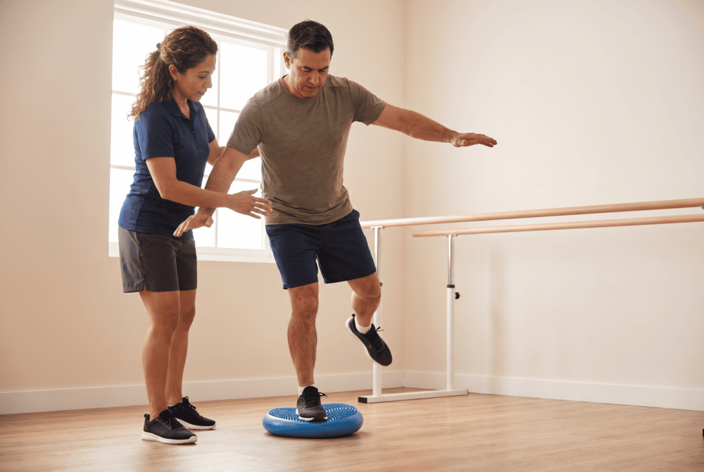 Patient performing single-leg balance and proprioceptive training on an unstable surface while recovering from ACL surgery in Pembroke Pines, Florida